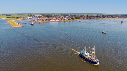 Aerial from fishing boats leaving the harbor of Stavoren in Friesland the Netherlands