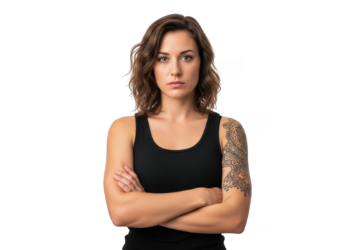Determined woman with arms crossed and tattoo on arm standing confidently isolated on transparent background