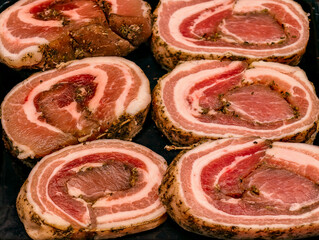 Rolled Pork Roast with Herb Seasoning Raw Meat Preparation Cross Section for Butcher Shop Display. Food Background 