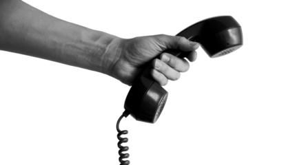 Urgent call concept with a hand holding old black telephone receiver, retro communication and connection