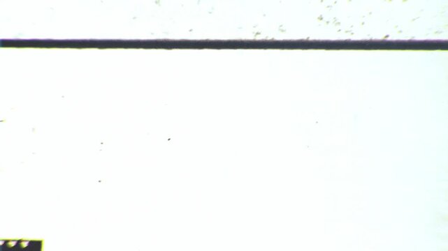 Looping microfiche scan transition in vertical and horizontal formats. Perfect for blending modes, archival looks and retro visual design.