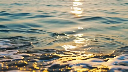 Golden sun setting on the calm ocean surface creates a beautiful abstract pattern of light and reflection in the blue water - Powered by Adobe