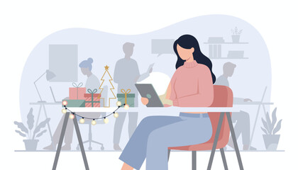 Professional woman uses tablet at a desk decorated for Christmas Holiday office work