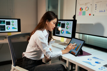 Business analyst working with data dashboard on tablet