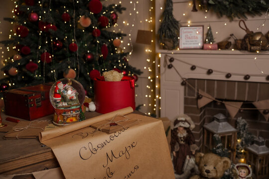 A festive New Year's background with a table and letters to St. Nicholas. Eastern traditions