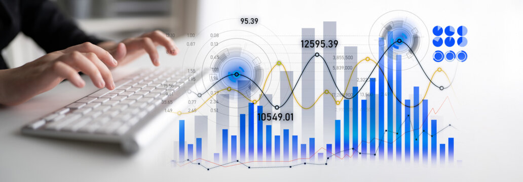 A close-up of hands typing on a keyboard with graphical charts and financial data displayed, illustrating business analysis and digital progress in a modern workspace. Scalp - Powered by Adobe