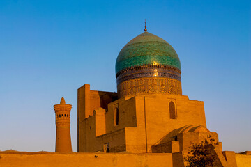 Uzbekistan architecture in Samarkand and Bukhara with intricate mosaics blue domes ancient madrasas Islamic patterns historic monuments vibrant tilework and cultural heritage in bright daylight