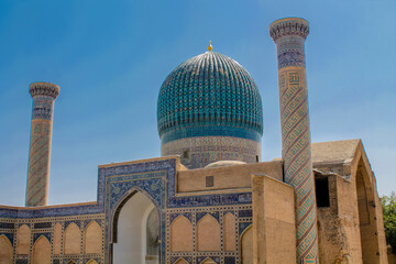 Uzbekistan architecture in Samarkand and Bukhara with intricate mosaics blue domes ancient madrasas Islamic patterns historic monuments vibrant tilework and cultural heritage in bright daylight