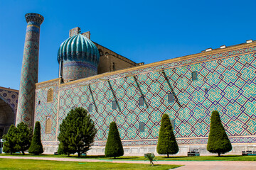 Uzbekistan architecture in Samarkand and Bukhara with intricate mosaics blue domes ancient madrasas Islamic patterns historic monuments vibrant tilework and cultural heritage in bright daylight
