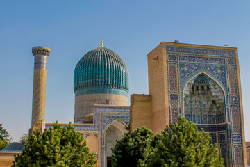 Uzbekistan architecture in Samarkand and Bukhara with intricate mosaics blue domes ancient madrasas Islamic patterns historic monuments vibrant tilework and cultural heritage in bright daylight