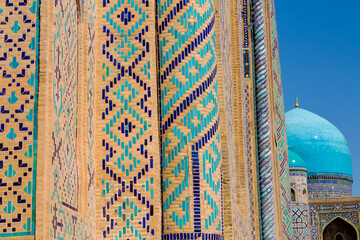 Uzbekistan architecture in Samarkand and Bukhara with intricate mosaics blue domes ancient madrasas Islamic patterns historic monuments vibrant tilework and cultural heritage in bright daylight