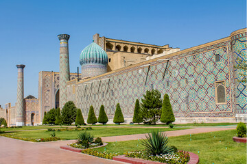 Uzbekistan architecture in Samarkand and Bukhara with intricate mosaics blue domes ancient madrasas Islamic patterns historic monuments vibrant tilework and cultural heritage in bright daylight