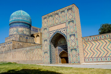 Uzbekistan architecture in Samarkand and Bukhara with intricate mosaics blue domes ancient madrasas Islamic patterns historic monuments vibrant tilework and cultural heritage in bright daylight