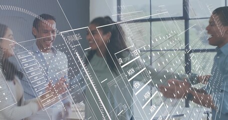 Clapping four coworkers in office attire celebrating, pointing at data overlays on conference table