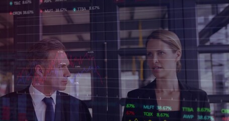 Analyzing market data, two traders wearing dark suit, dark blazer in modern office, glass display