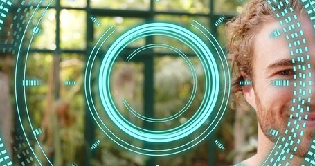 Standing white man facing camera at home by grid window, showing turquoise HUD overlay, copy space