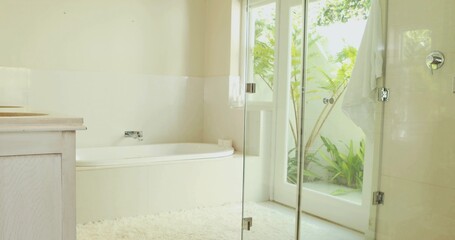 Featuring built-in alcove bathtub gleaming with chrome faucet in home bathroom, showing plush rug