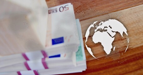 Displaying banded 50 EUR bills with straps on wooden table, showing white dotted map and globe