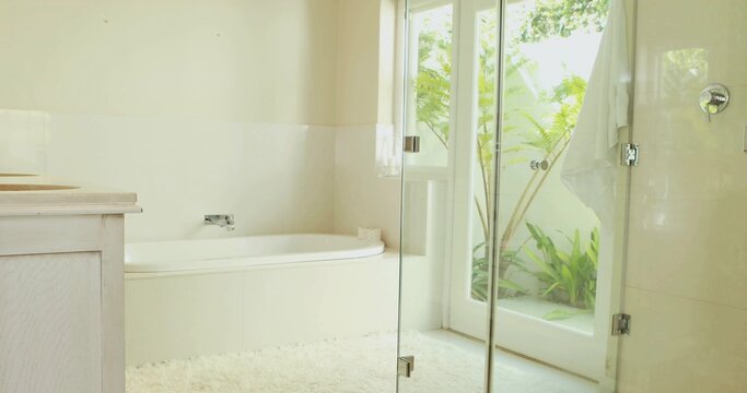 Featuring built-in alcove bathtub gleaming with chrome faucet in home bathroom, showing plush rug