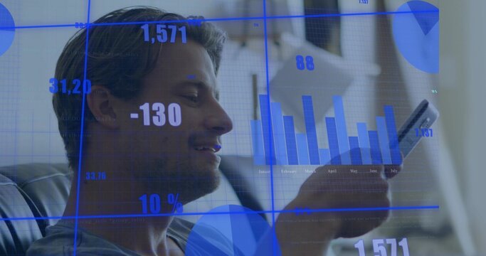 Reclining man holding smartphone on leather sofa at home, wearing grey tee with finance overlay