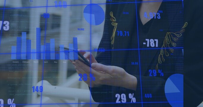 Holding smartphone, woman in dark blazer with gold trim viewing blue data charts at office - Powered by Adobe