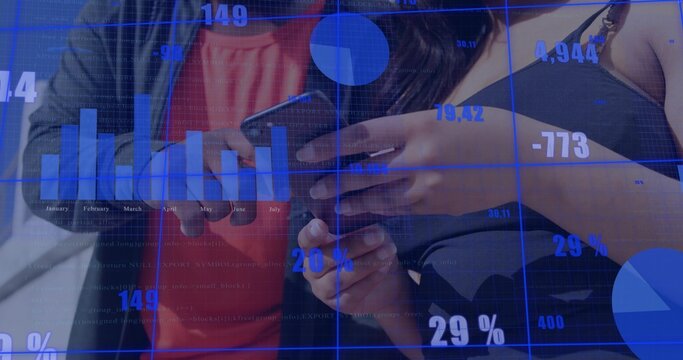 Reviewing colleagues viewing phone with data overlay 29% charts at desk, red top, black strappy top