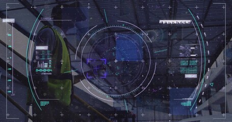 Standing warehouse technician scanning AR HUD on metal stair landing, wearing high-visibility vest