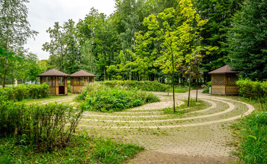 Peaceful Garden With Winding Brick Path And Gazebos In Victory Park On Poklonnaya Hill, Moscow, Russia, 10 August 2025