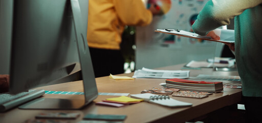 A dynamic business meeting takes place in a modern office setting, where diverse professionals collaborate on innovative ideas and strategies using technology and visual aids. SACTR