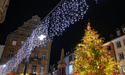 Christmas lights with the decorated Christmas tree on the market place at night. Constance, Baden-W&uuml;rttemberg, Germany.