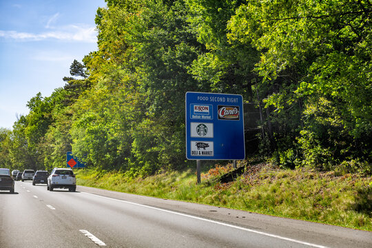 Crozet, USA - April 27, 2025: Spring season in Virginia Blue Ridge highway i64 with sign for exit to Charlottesville, Ivy 250 road and stores