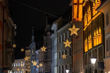 The streets of the Old Town are adorned with beautiful star-shaped Christmas lights at night. Konstanz, Baden-W&uuml;rttemberg, Germany.