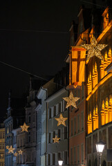 The streets of the Old Town are adorned with beautiful star-shaped Christmas lights at night. Konstanz, Baden-W&uuml;rttemberg, Germany.