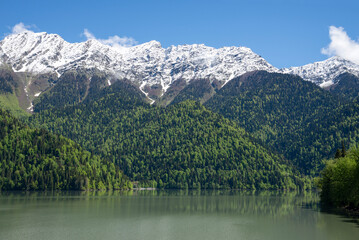 Fototapeta premium Lake Ritsa and snow-capped mountain peaks, Abkhazia