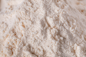 Close-up of zinc oxide (ZnO) powder with a fine, white, and chalky texture. Commonly used in industrial, chemical, cosmetic, and pharmaceutical applications. Clean and detailed macro view.