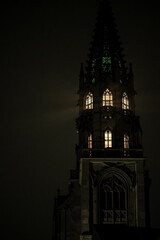 The illuminated tower of the M&uuml;nster unserer lieben Frau cathedral at night. Constance, Baden-W&uuml;rttemberg, Germany.