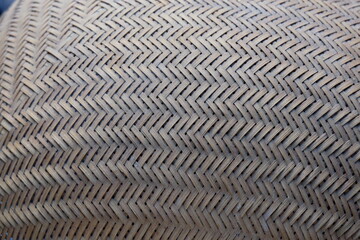 The intricately woven kitchen utensil, handcrafted from thin, pliable strips of natural wood, serves as a rustic and functional tool, embodying centuries of artisanal skill and bringing an organic.