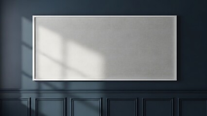 Blank display frame on a modern dark blue wall with natural sunlight shadows.