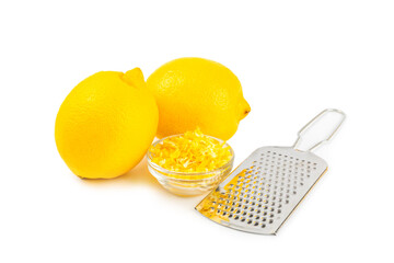 Lemon fruit zest. Fresh yellow organic lemons and a grater isolated on a white background. Citrus zest grater. Lemon twisted peel. Vitamin C. Space for text. Copy space.