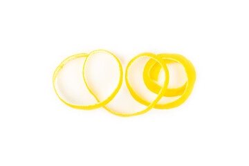 Lemon fruit zest. Fresh yellow organic lemons and a grater isolated on a white background. Citrus zest grater. Lemon twisted peel. Vitamin C. Space for text. Copy space.