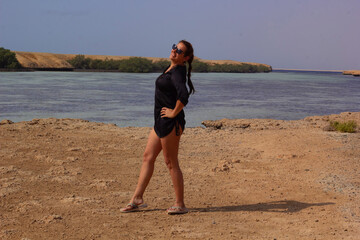 portrait of young woman in sunglasses on the beach in Red Sea Egypt	