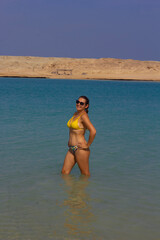 portrait of young woman in sunglasses on the beach in Red Sea Egypt