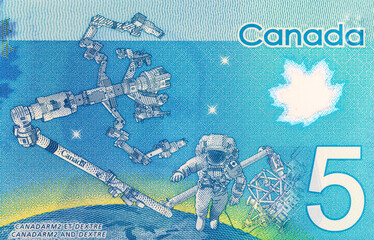 5 Dollars Canada, 2013 with the image of Dextre and canadarm2. International Space Station. Polymer...