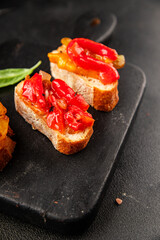 Bruschetta roasted pepper vegetable dish natural product tasty snack fresh delicious gourmet food background on the table rustic top view copy space vegan and vegan food