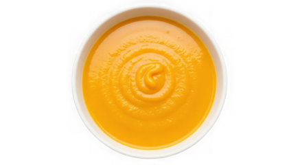 Creamy orange soup in a white bowl isolated on transparent background