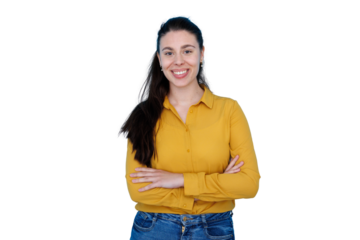 Confident young woman smiling with arms crossed, wearing yellow shirt and blue jeans, transparent background