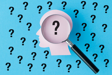A figurine of a human head and a question mark, Decision-making and life choices.