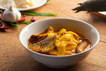 Southern style sour and spicy soup,Yellow Thai Curry Sour Bamboo Shoot with canned fish in a bowl.