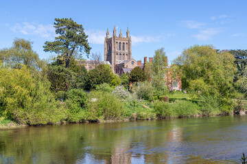 Obraz premium Hereford Cathedral viewed across the River Wye on Easter Sunday, Hereford, Herefordshire, England UK