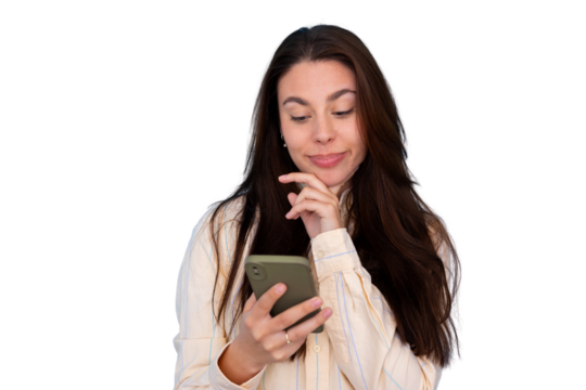 Woman holding a mobile phone, looking down, interacting with technology, and contemplating while reading content - Powered by Adobe